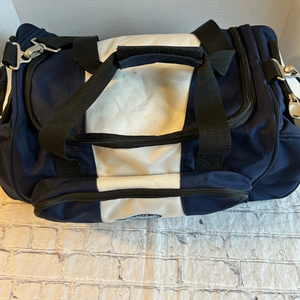 RUSSELL EXCLUSIVELY DISTRIBUTED BY PREMIUM BAGS,LLC LOGO NCCA FINAL FOUR DUFFEL